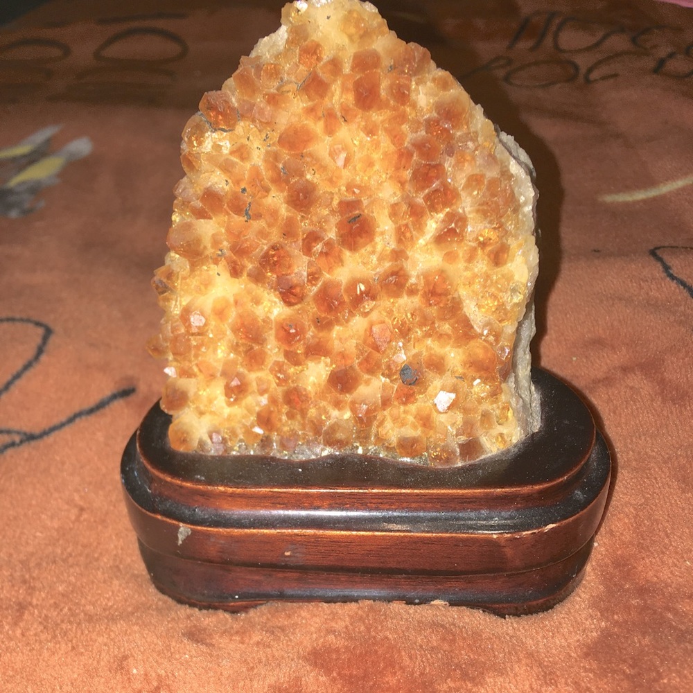 A Citrine geode quartz, from crystal vision, color is yellowish orange, medium.
